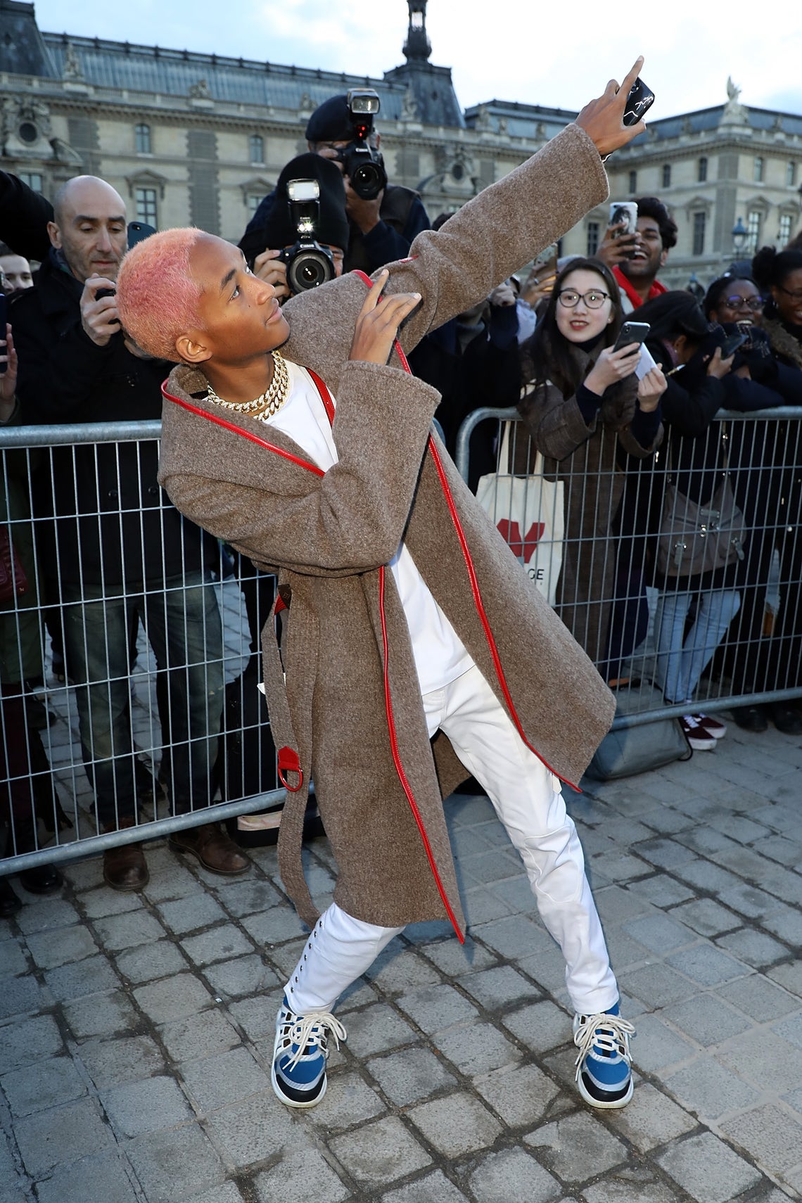 Jaden Smith is living like an icon with pink hair, chains and Louis Vuitton's Archlight Sneakers from the women's section of LV. Smith is above being trendy, staying true to his word when he rapped "I'm about to do it way different." As GQ noted, Smith is rocking "mom style" when the rest of the world is hung up on dads.