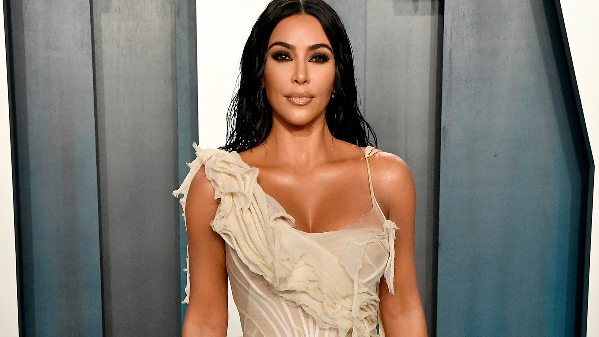 Kim Kardashian Gets Soaked in Vintage Alexander McQueen Dress During Sizzling Photo Shoot