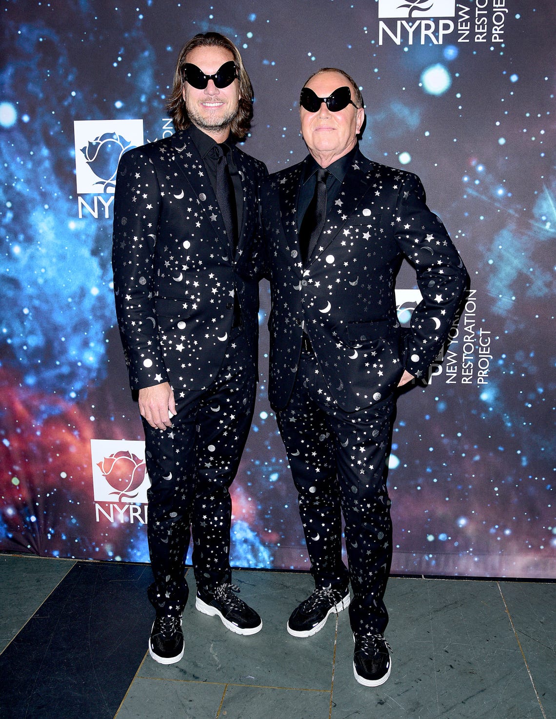 Lance LePere and fashion designer Michael Kors Attend Bette Midler's New York Restoration Project's 22nd Annual Hulaween Event at Cathedral of St. John the Divine on October 29, 2018 in New York City.