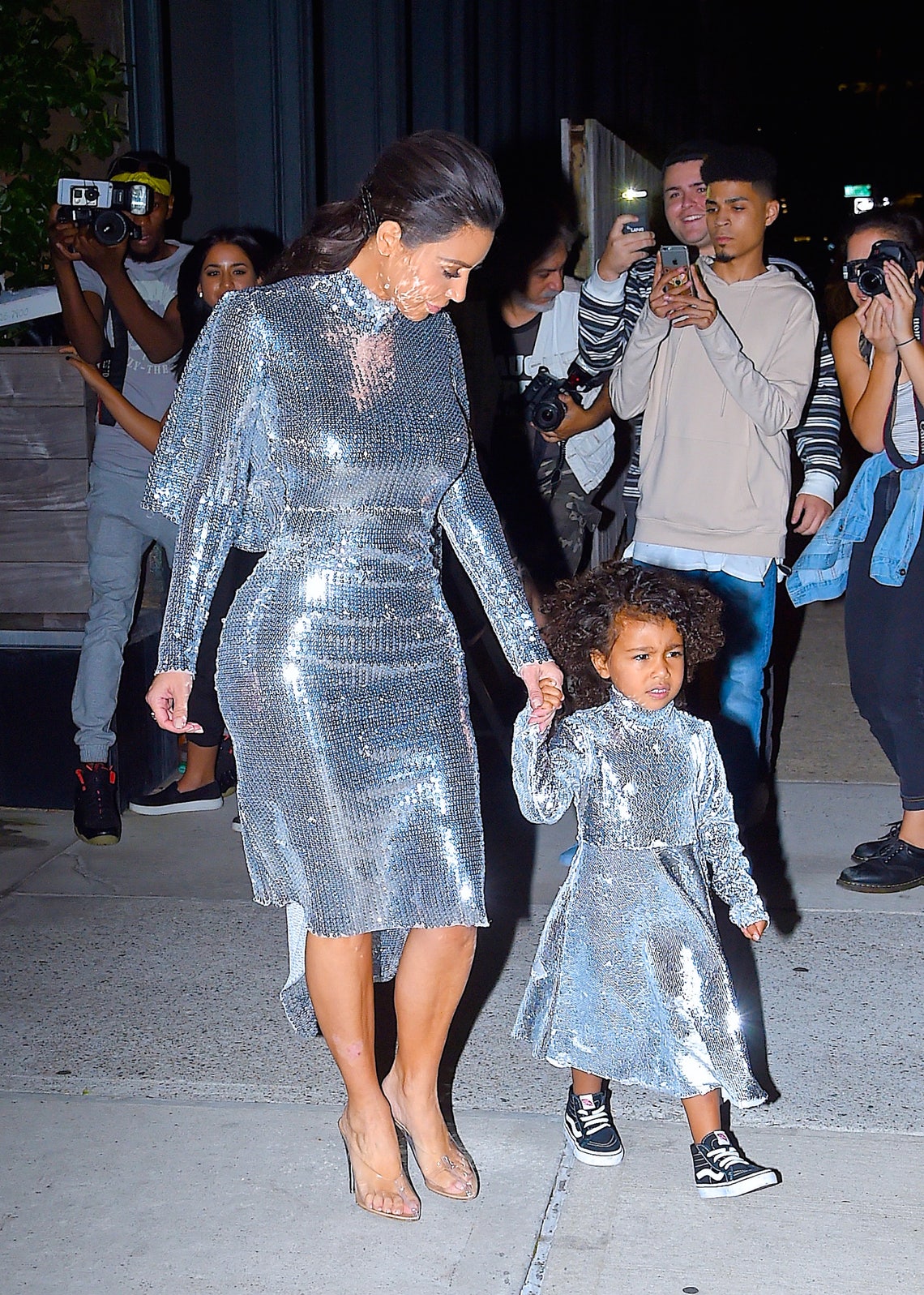 Kim Kardashian and North West sport matching outfits to Kanye's show in NYC (September 6, 2016).
