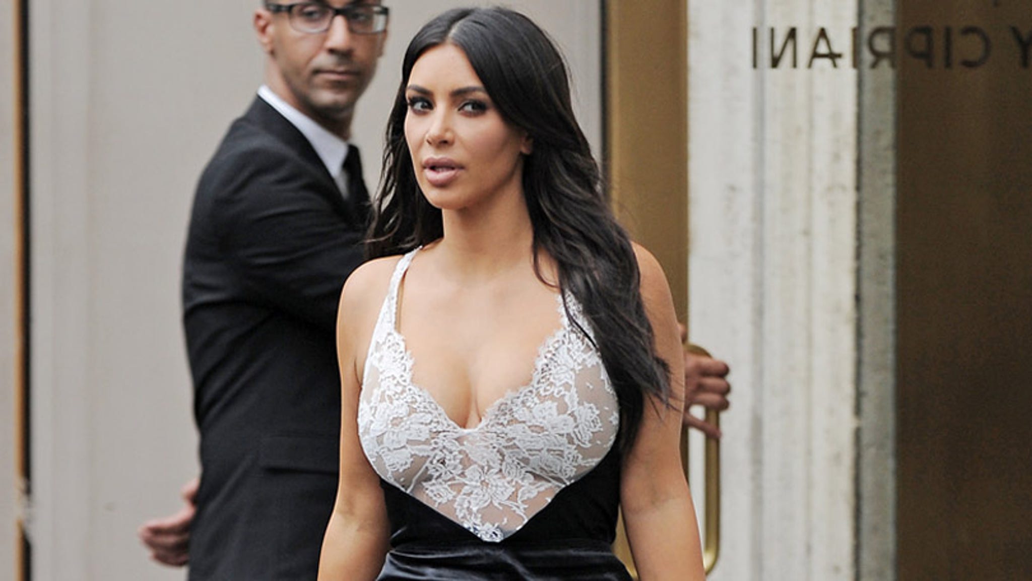 Kim Kardashian Nearly Spills Out of Her Plunging Lace Dress Before