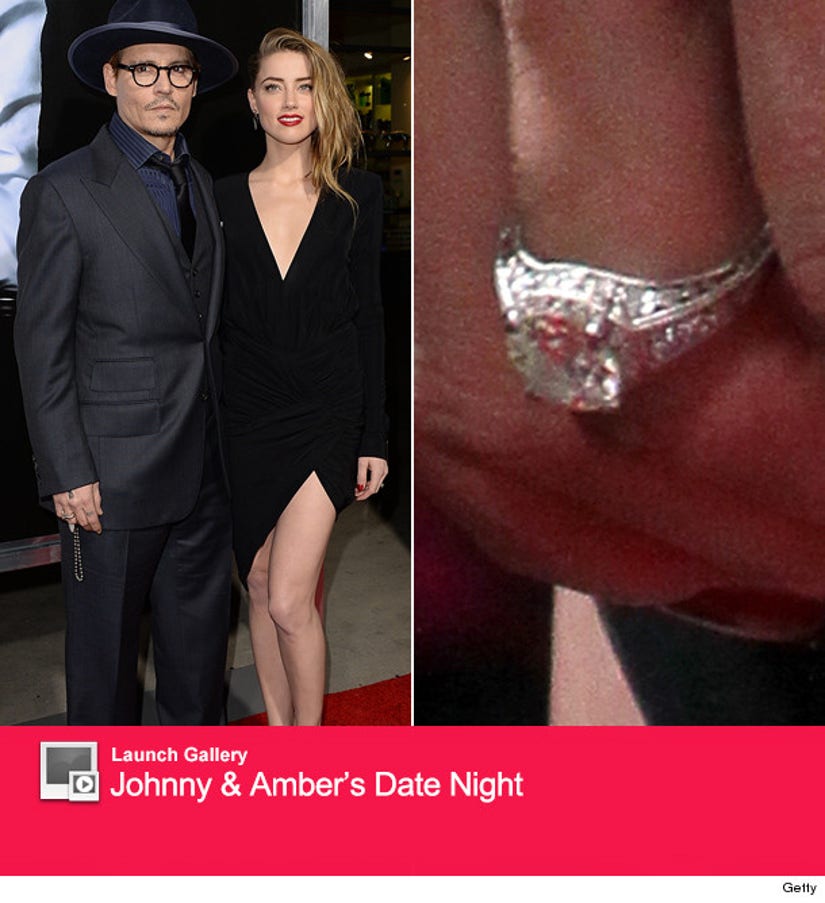 Johnny Depp And Amber Heard Share Rare Pda See Her Huge Engagement Ring 