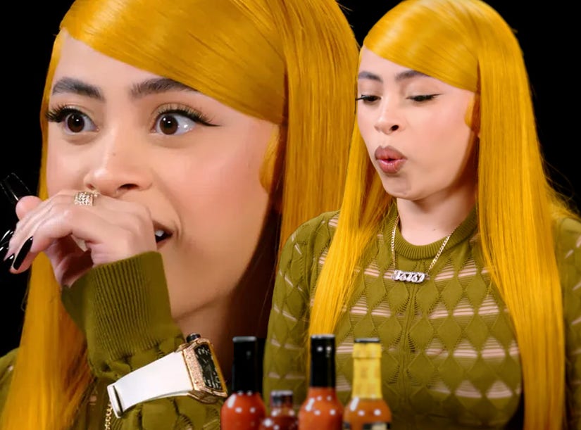 Ice Spice Can't Handle the Spice, Taps Out on Hot Ones, Reveals Origin
of 'Stop Playin' with 'Em, Riot' Tag