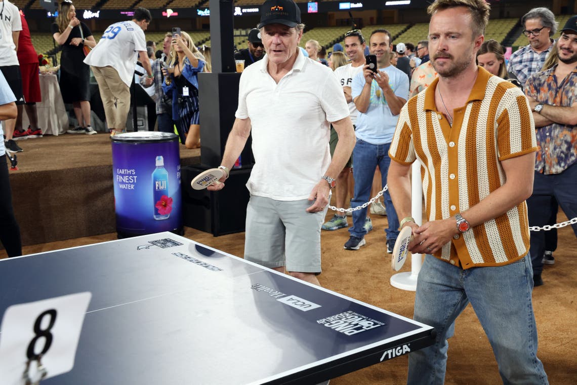 Bryan Cranston and Aaron Paul with FIJI Water and JUSTIN Vineyards and Winery at Ping Pong 4 Purpose 2023 at Dodger Stadium on July 27, 2023 in Los Angeles, California.