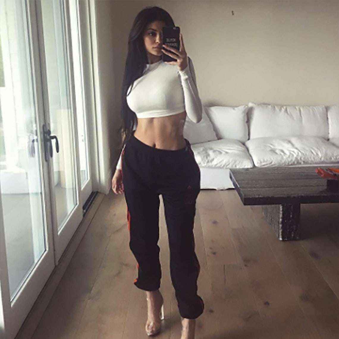 Kylie Jenner shows off her toned stomach as she in Chanel crop top
