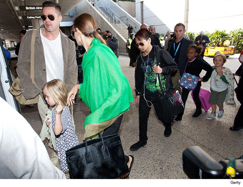 Angelina Jolie At LAX With Sons Maddox And Knox