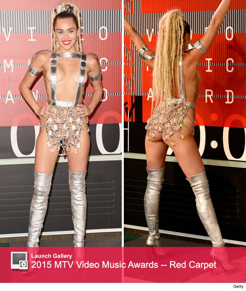 X See All Of The Ridiculously Revealing Outfits Miley Cyrus Wore At The Vmas News 8963