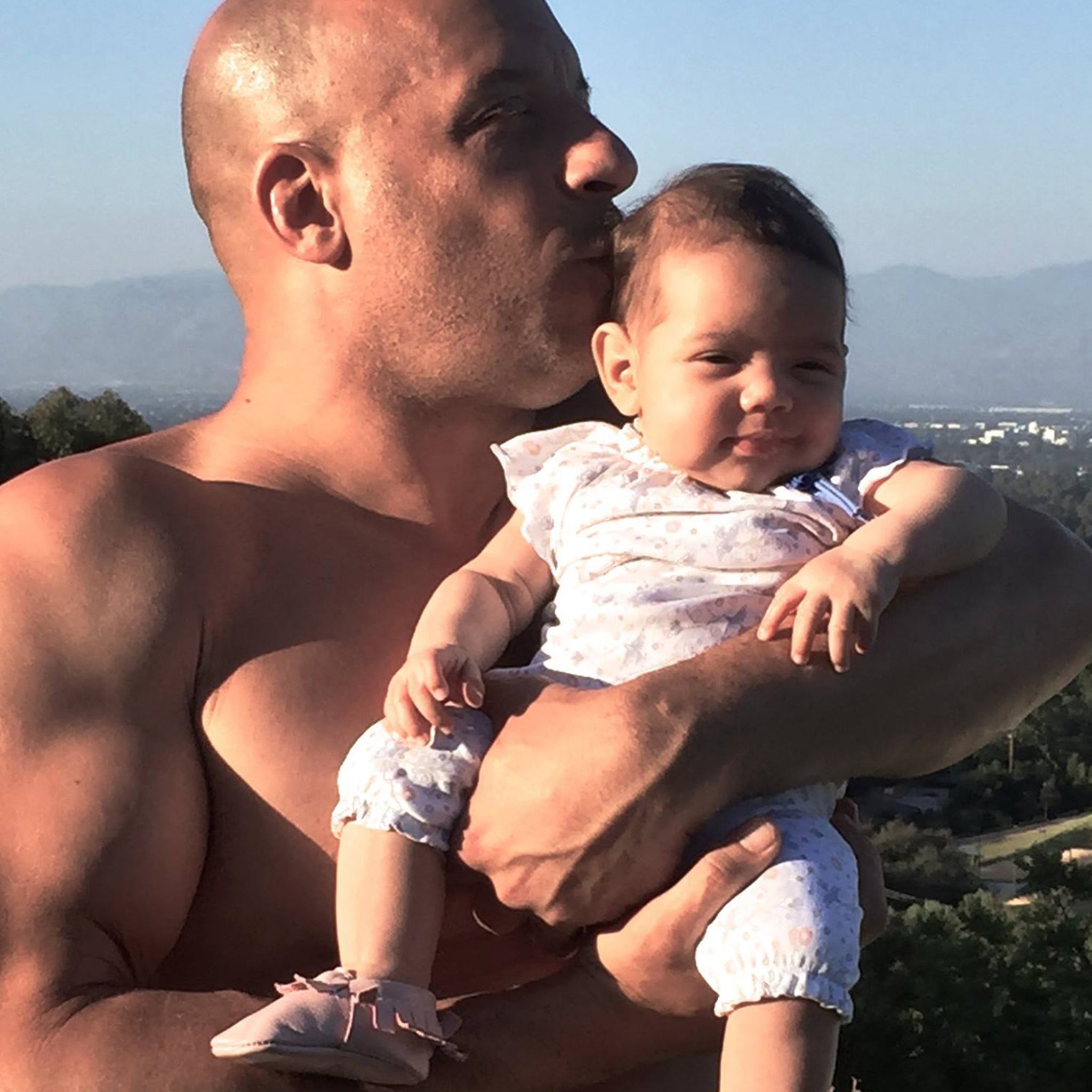 Vin Diesel Shares Shirtless Pic Holding Baby Pauline Following Body-Shaming