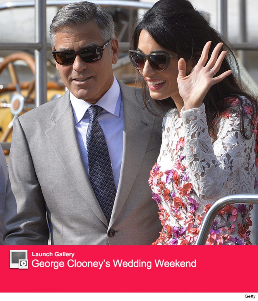 See First Photos Of George Clooney Amal Alamuddin S Wedding Rings