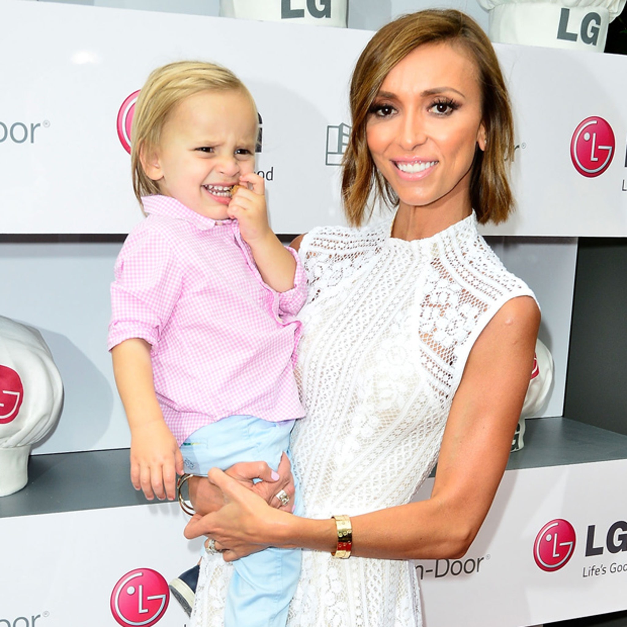 Giuliana Rancic is spied looking at fashionable new baby clothes