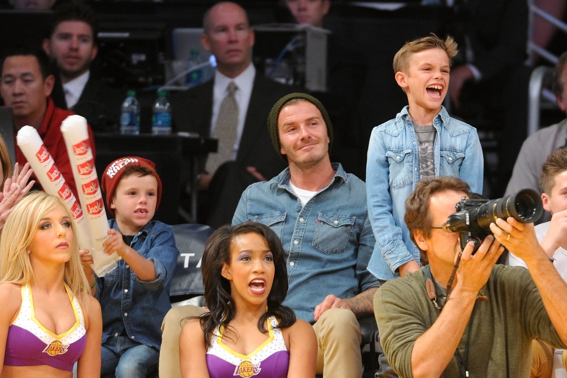 David Beckham spends some time with his sons Brooklyn, Romeo and Cruz  rink-side at the LA Kings game