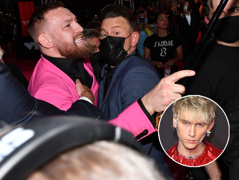 Conor McGregor knocks back shots in a tux at party in West Hollywood amid  Machine Gun Kelly drama