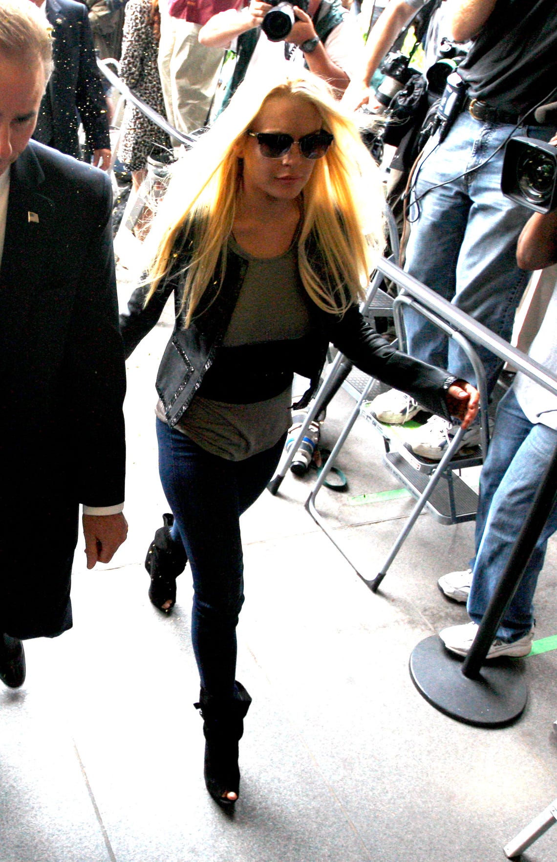 Lindsay Lohan leaving her Hollywood residence wearing short shorts and  reflective Ray-Ban Aviator Los Angeles, California Stock Photo - Alamy