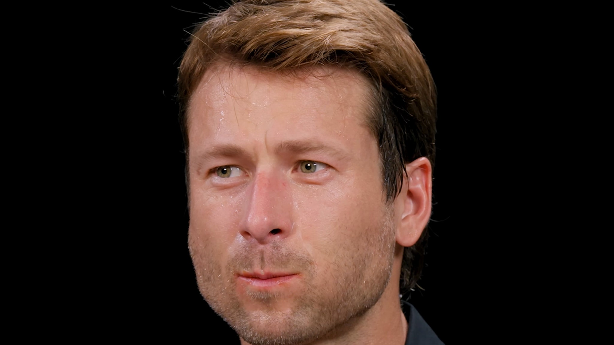 Glen Powell Gets ‘Soaked’ Eating Spicy Wings on Hot Ones: ‘No Mercy’