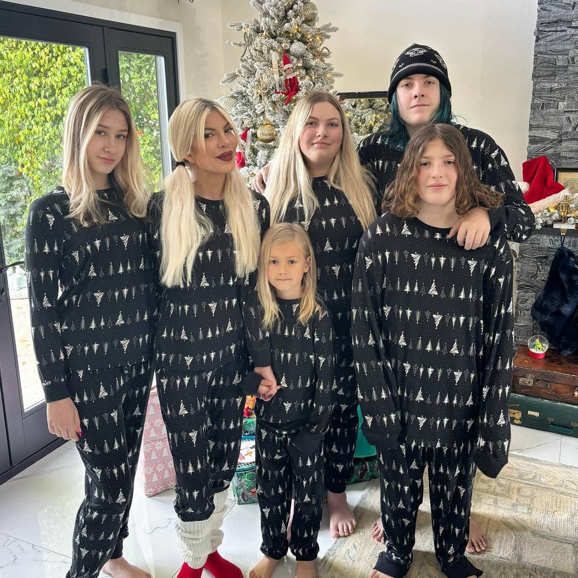 "Love Actually… Merry Christmas and Happy Hanukkah to all. Sending love from our family to yours" Tori Spelling and her kids