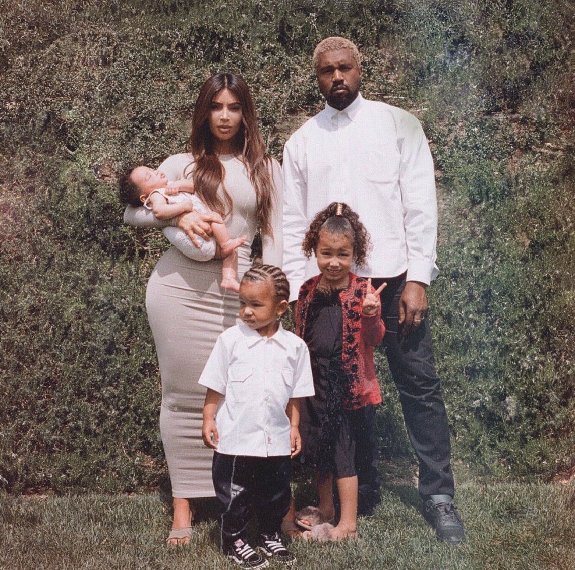 "I don’t think you really understand how hard it is to take a good family pic. This was all we got before all three kids started crying. I think I cried too," Kim Kardashian